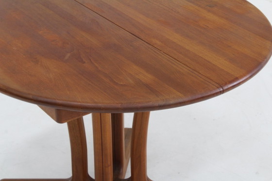 Image 1 of Vintage Dyrlund Deense ronde uitschuifbare eettafel massief teak 