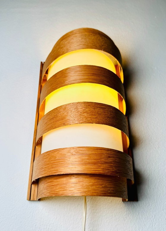 Image 1 of Elegant mid-century wall lamp crafted from curved pine veneer, produced in Sweden during the 1960s.