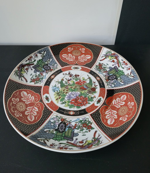 Piatto giapponese in ceramica Imari con motivo a pavone.
