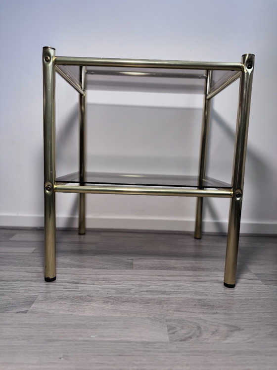 Vintage Regency stule  two-tier side table or nightstand featuring a brass-finished metal frame and smoked (photo 5 of 14)