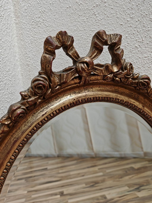 Oval mirror with wooden frame, gold from an estate