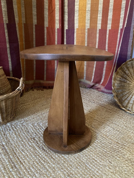 Wooden stool with convex seat