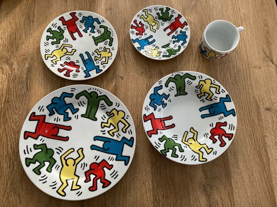 Image 1 of Keith Haring Dinnerware: 3 different sized plates, 1 coffee cup and saucer.