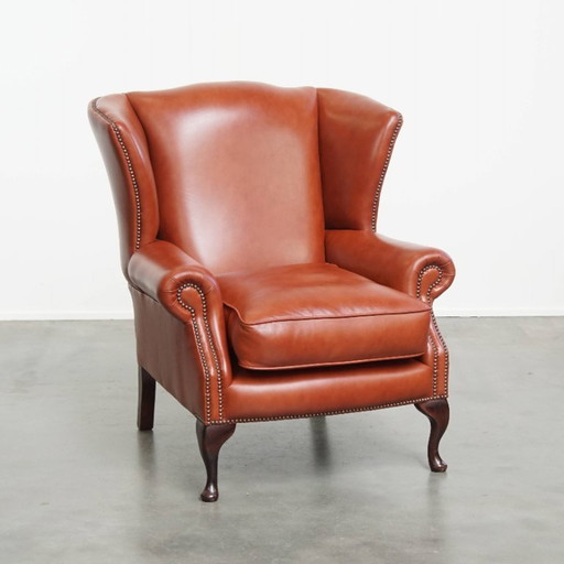Comfortabele Engelse chesterfield oorfauteuil van rundleer