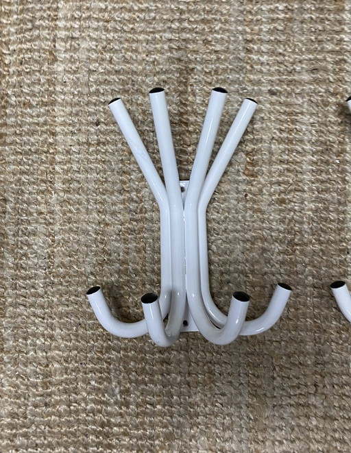 Two vintage heavy metal coat racks