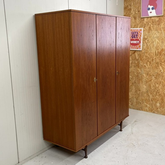 Sleek Danish vintage 3-door wardrobe with hanging and shelving – Wood (photo 3 of 12)