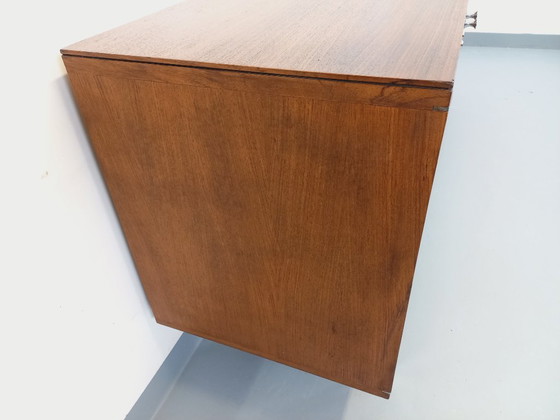 Image 1 of Vintage modern dressoir van palissanderhout en verchroomd metaal uit de jaren 60 en 70.