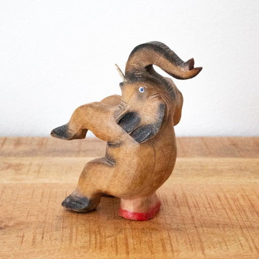 Vintage hand-carved circus elephant figurine: handmade animal sculpture