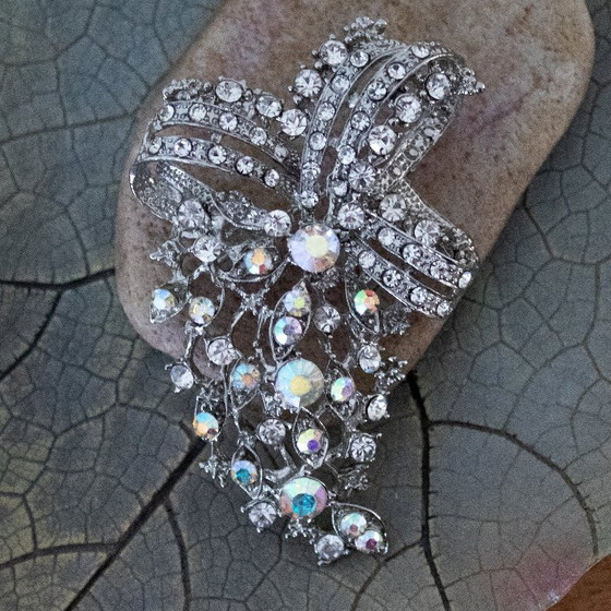 Image 1 of Vintage Aurora Borealis ribbon brooch: Iridescent and transparent rhinestones