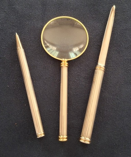 Magnifying glass, ballpoint pen and paper knife, office decor