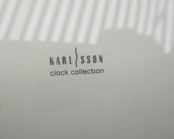 Image 1 of Karlsson Zonneklok vergulde 22k goud zware wandklok uit eind 20e eeuw werkt prima.