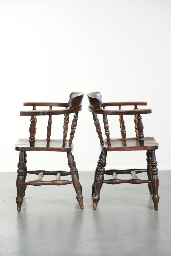 Image 1 of 2x antique English wooden pub/captain chairs from the late 19th century with character and a beautiful color scheme