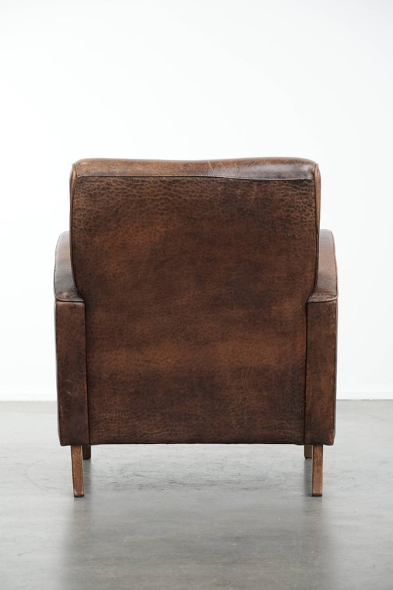 Image 1 of Vintage schapenleren armchair met een ronde vormgeving 