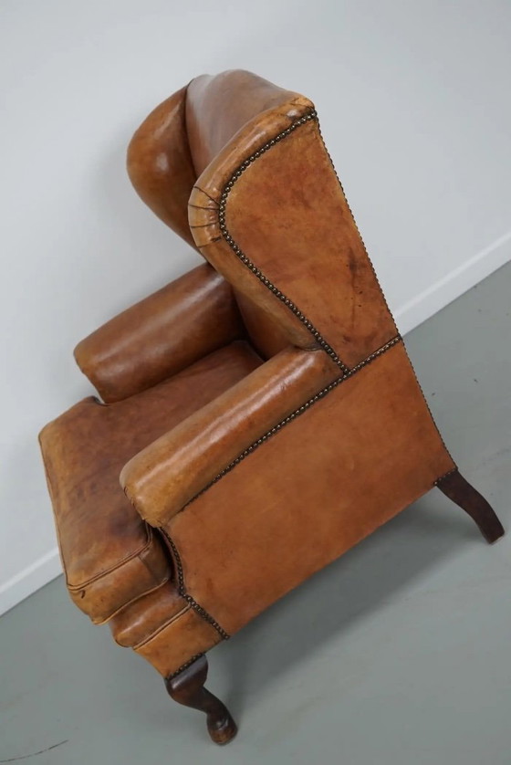 Image 1 of Vintage Nederlandse cognackleurige leren clubfauteuil met voetenbank