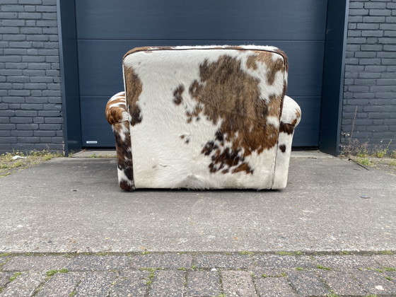 Image 1 of Alfred P baxter fauteuil koeienhuid 