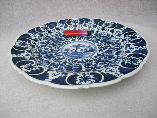 Old Delft, Blue and white plate and bowl, Old Delft pottery, painted by P.H.v. Praag.