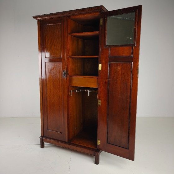 Image 1 of Men's clothing by Maple & Co. from the early 20th century.