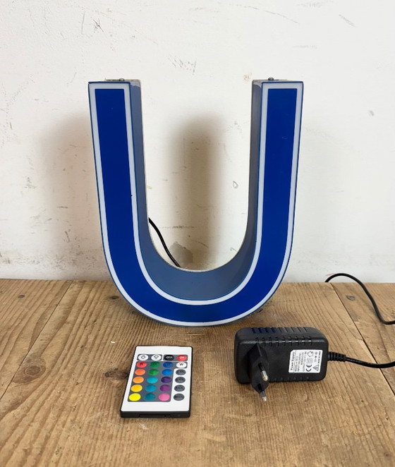 Image 1 of Industrial dark blue enamel factory pendant light made in United Kingdom during the 1950s. White enamel inside the shade. Brass 