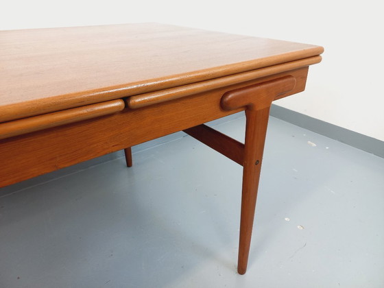 Image 1 of Vintage Scandinavian rectangular dining table by Ejvind A. Johansson from the 50s and 60s in teak with integrated extensions