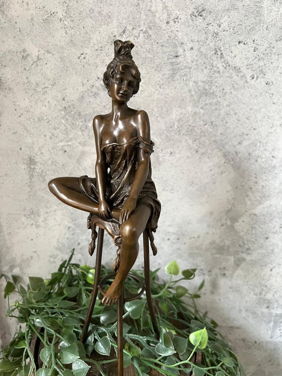Image 1 of Bronze statue of a woman on a stool