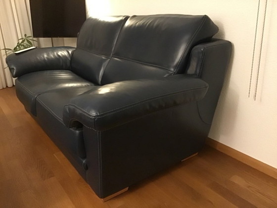 Image 1 of 2 blue leather sofas