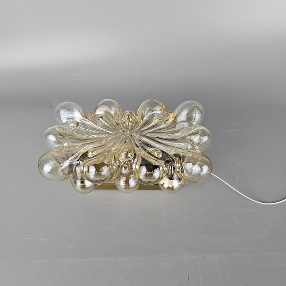 Image 1 of Vintage glass bubble wall lamp by Glashutte Limburg. Design by Helena Tynell. Glass and brass. 1960, Germany.