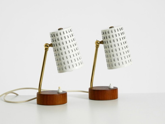 Image 1 of A pair of beautiful mid-century modern bedside lamps with perforated metal shades and teak wood bases