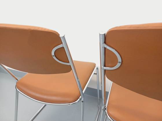 Image 1 of Set di 4 sedie a slitta vintage degli anni '70 in metallo cromato e similpelle color cognac