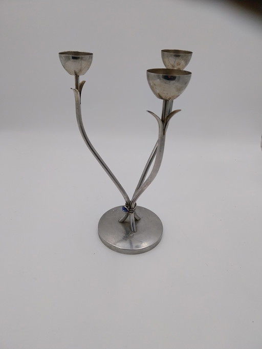 Un candelabro Art Déco a tre luci. Spagnolo, anni '70, in acciaio inossidabile.