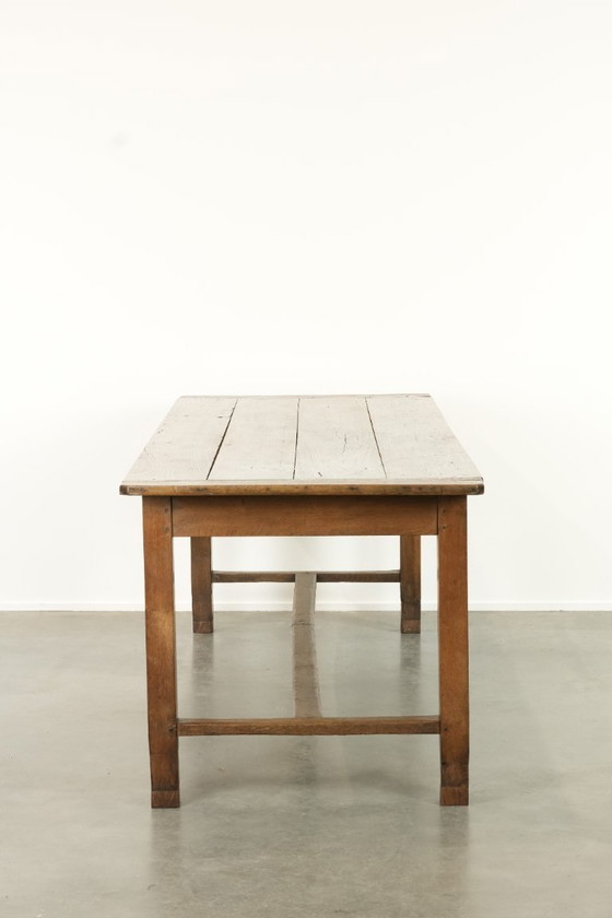 Image 1 of Large antique French farmhouse dining table made of oak from the early 1800s