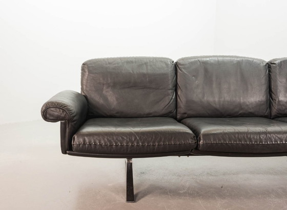 Image 1 of Exquisite Mid-Century Design De Sede Black Leather Strap Stitched Three-Seat Sofa DS31. Switzerland, 1960s.
