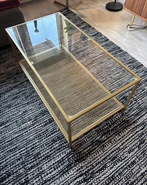 Table basse en verre et métal doré