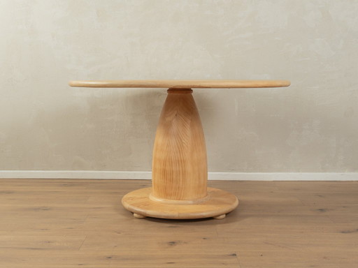 Table de salle à manger des années 80 avec un épais piètement en bois