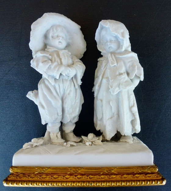 Image 1 of Luxury sponge porcelain figurine with gold leaf finish.