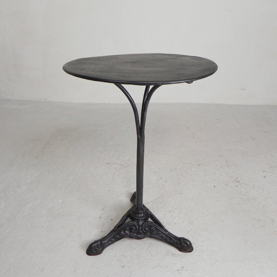 Image 1 of Bistro table with cast iron legs and round steel top, 1930s