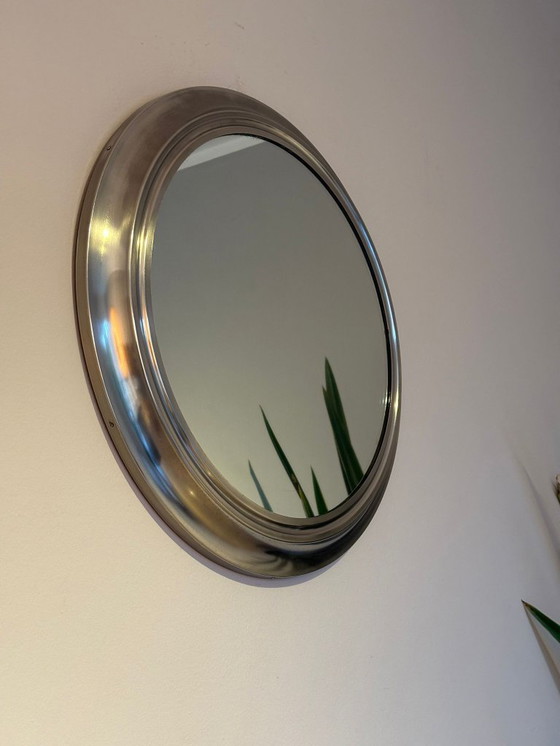 Image 1 of round mirror with metal frame, dating back to the 1970s