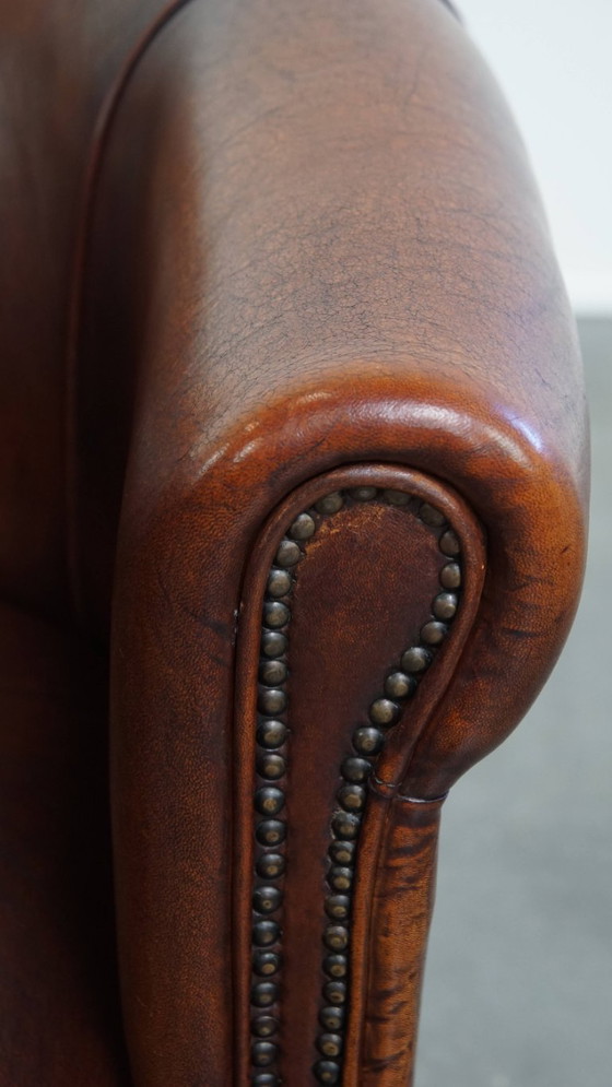 Image 1 of Sheep Leather Club Chair in a Dark Cognac Color