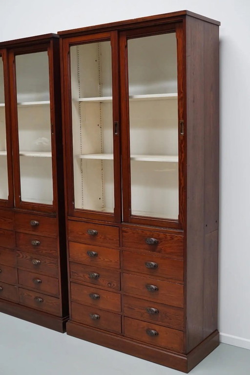 Large antique Belgian apothecary cabinet / display cabinet made of pitch pine, ca. 1900
