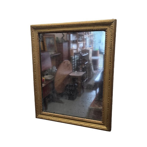Antique wooden gold-colored mirror