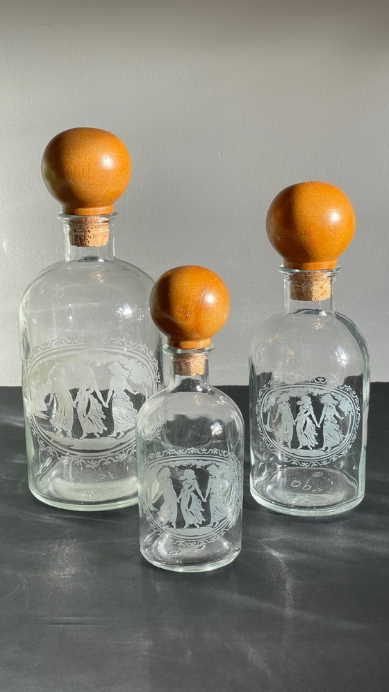 Image 1 of Vintage Engraved Glass and Wood Bottles