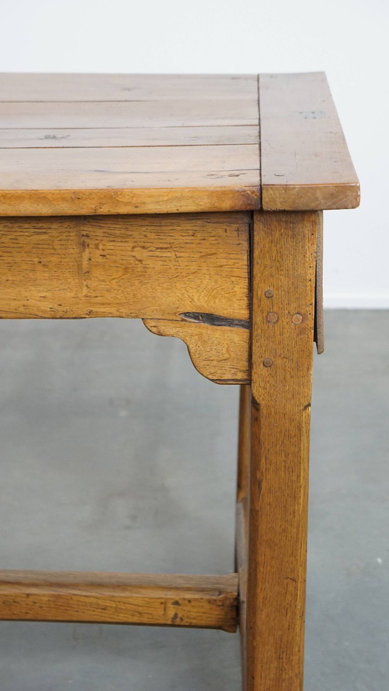 Image 1 of Large antique French farmhouse dining table made of fruitwood from the late 18th century with beautiful and original details.