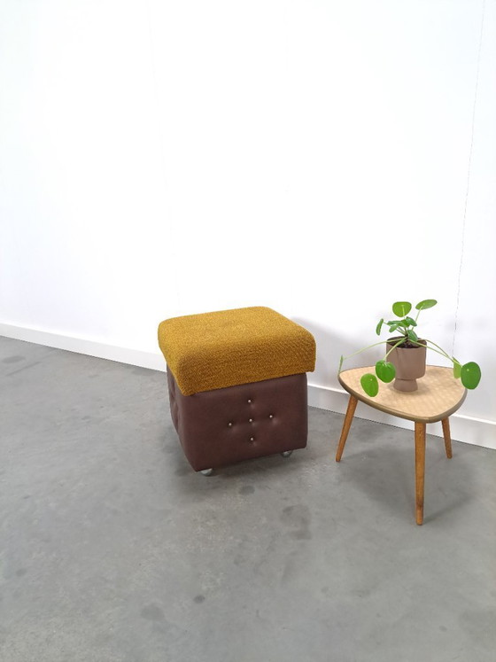 Image 1 of Ottoman with lid on chrome wheels