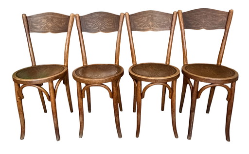 Set of 4 W. Baumann & Cie chairs