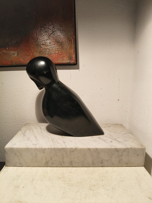 Vintage design modernist black marble sculpture of a stylized abstract bird on a white marble base