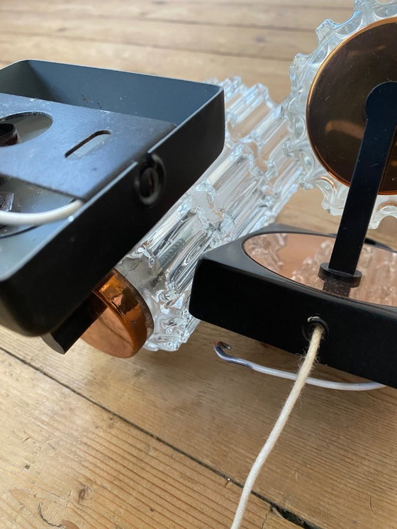 Image 1 of Een paar vintage koperen wandlampen van Phillips uit de jaren 70.