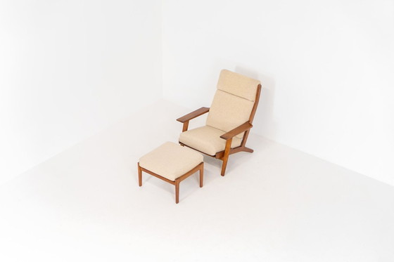 Image 1 of Early GE-290A lounge chair + ottoman in oak by Hans J. Wegner for Getama (Denmark, 1953).