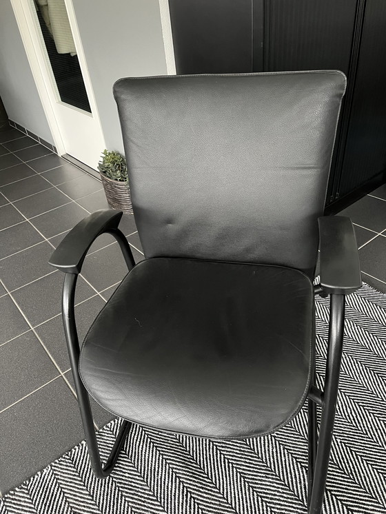 Image 1 of Beechwood dining table with 4 black leather chairs