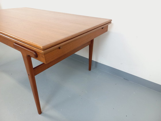 Image 1 of Vintage Scandinavian rectangular dining table by Ejvind A. Johansson from the 50s and 60s in teak with integrated extensions