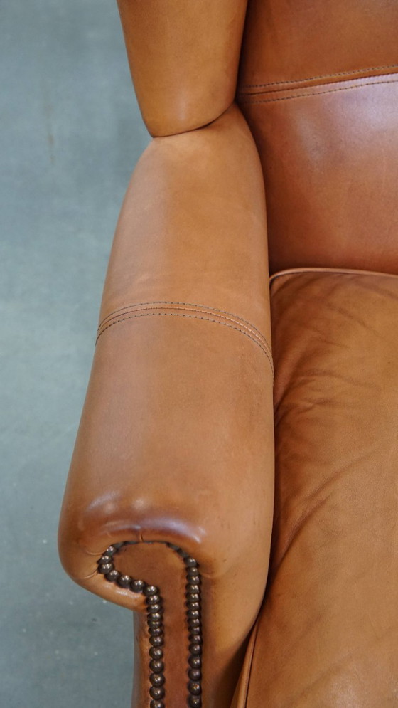 Image 1 of 2x Rundleren oorfauteuil afgewerkt met siernagels