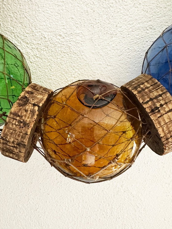 Image 1 of Fishing float made of blown glass, cork, and rope. France, 1960s